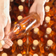 Factory worker examining bottle in plant